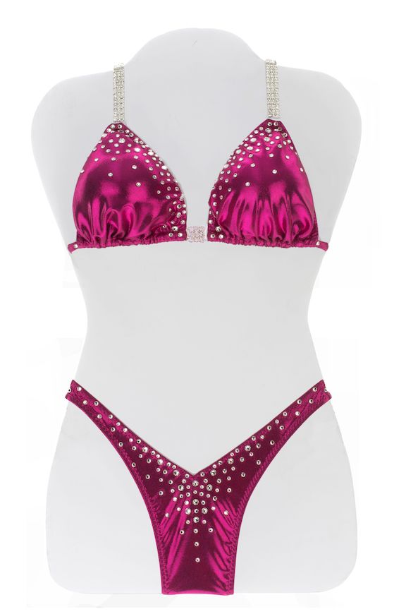 JW Couture custom Figure & Women's Physique competition suit. Crystal rhinestones fade from the inside edge of the top and fade downwards on the bottoms. Fabric is a shiny fuchsia. Handmade in Canada.